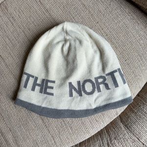 Grey and white reversible north face beanie